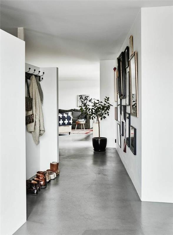 0-modernus-prieškambaris-dekoratyvinis-betonas-betonas-stalviršis-vaškas-pilkos grindys-baltos sienos koridoriuje