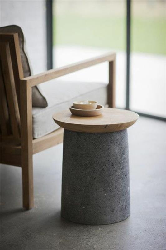 0-prašmatnus dizaino kavos staliukas-konforama akmenyje ir šviesaus medžio skaitymo kėdės skaitymo kampe