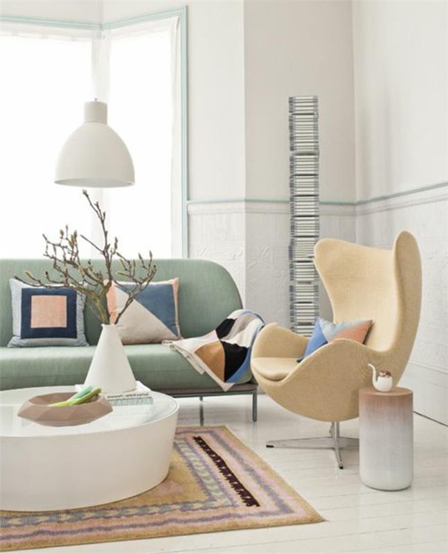 0-relax-fotelis-smėlio spalvos-konforama-modernioje-gyvenamojoje patalpoje-spalvotas kilimas-šviesiai mėlyna-sofa