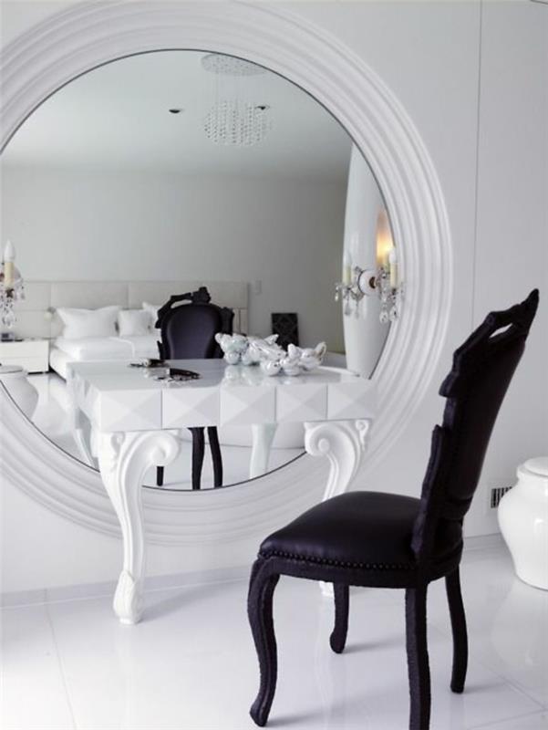 0-gražus-komodos baldų skraidymas su apvaliu veidrodžiu ir juoda kėdė-grindys su baltomis plytelėmis