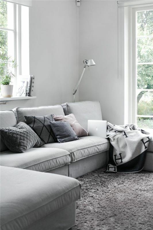 1-lepa-dnevna soba-s-sivim-kotnim kavčem-sivimi blazinami-in-lepa-dnevna soba-s sivo preprogo in belimi stenami