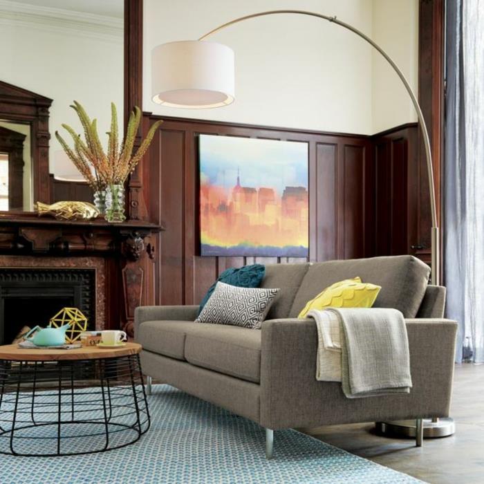 1-ark-lamba-in-the-modern-oturma odası-açık-mavi-halı-ve-gri-kanepe-dekoratif-yastıklar