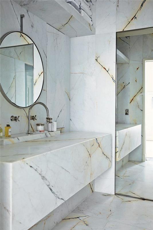 1-marmurinis vonios kambarys-modernus vonios kambarys-baltos spalvos modelis su apvaliu veidrodžiu
