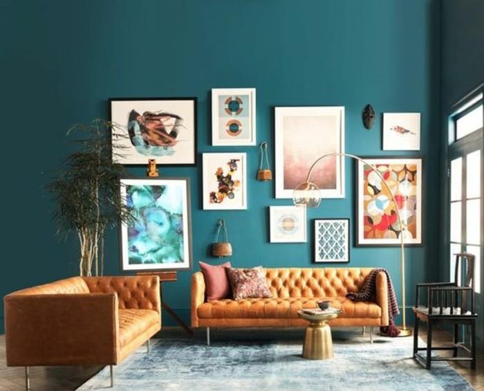 yağlı-mavi-oturma odası-boya-renk-modern-turuncu-kanepeler-dekoratif-zenginlik-elemanları