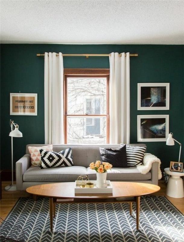 a-çözüm-çok-trend-renk-duvar-oturma odası-zümrüt-yeşil-gri-kanepe-oval-masa-çok güzel-siyah-beyaz-halı