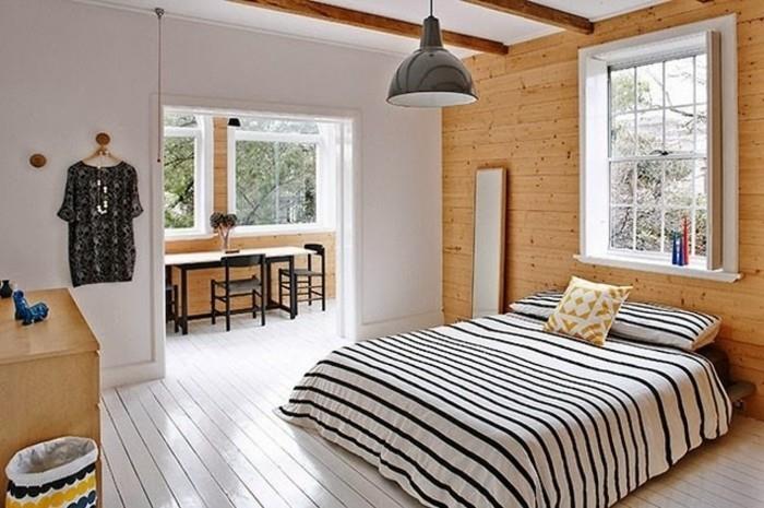 Skandinaviška atmosfera su kaimiško stiliaus dailylentėmis-pramoninė-pensija-vieno miegamojo dizainas, kuris atsidaro mažoje valgomojo zonoje