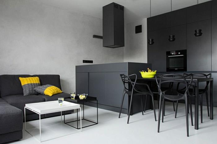 mažas virtuvės išdėstymas antracito pilka spalva, lentų grindys, virtuvės sala, pilkos ir geltonos pagalvėlės, geltonas dubuo