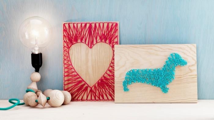 lengva rankinė veikla su šviesia mediena ir raudonu siūlu, medinė lenta su širdies formos raudonų siūlų apdaila