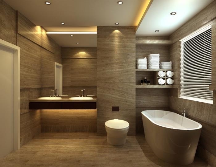 kopalnica v bež barvi s stensko oblogo in svetlim lesenim podom, beli viseči stropni model z rumeno LED osvetlitvijo