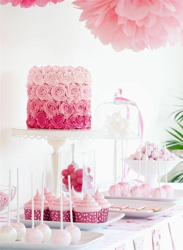 pembe şeker çubuğu dekorasyonu, kekler, lolipop pasta ve taze kremalı gül pastası, beyaz şekerlemeler, pembe kağıt mendil çiçekler
