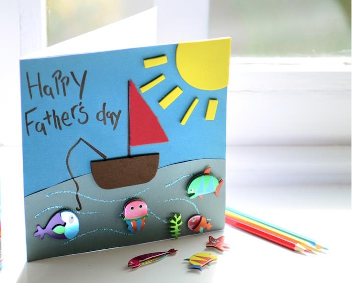 keçe tekne güneş balık figürleri gri ve beyaz arka plan kağıt hediye fikri babalar günü maiosn yaptı