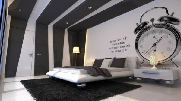 juoda-balta-interjero-miegamojo dizainas-su-sieniniu plakatu-juodu kilimu-945x531