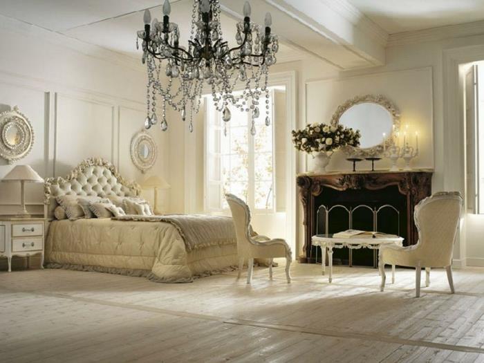 boudoir spalnica, bele stene, oblazinjeno vzglavje, bela nočna svetilka, laminatni parket
