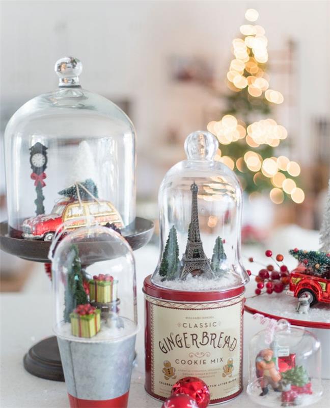 Kendiniz yapmak için Noel dekorasyonu, kutular ve diğer destekler üzerinde şeffaf Noel çanları altında dekorasyon, figürinler Noel motifleri, karlı Eyfel Kulesi