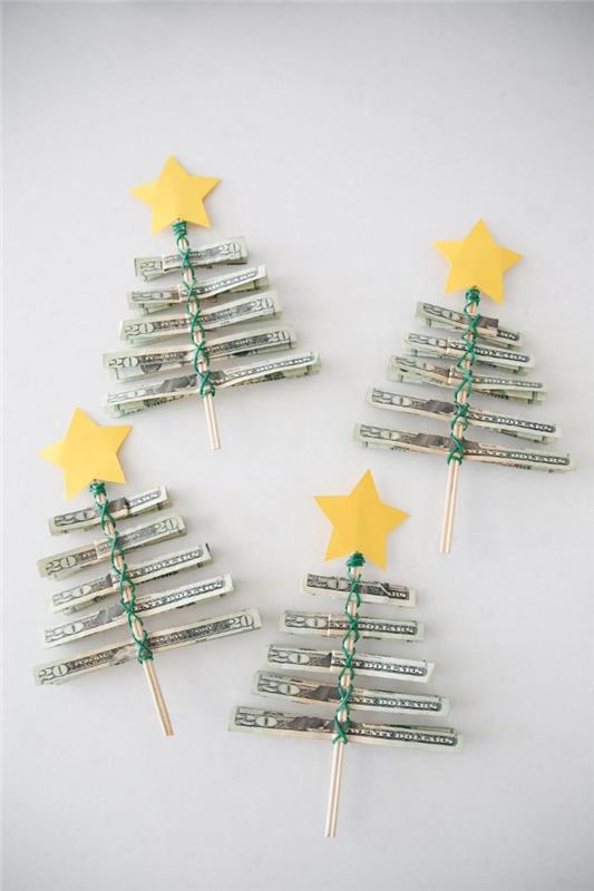 domače božično darilo diy božična drevesca v srebrni barvi, zložena na zobotrebce in okras na vrhu z rumenim papirjem