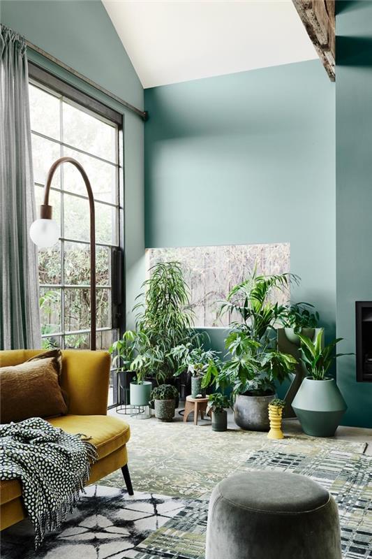 su yeşili duvarlara ve beyaz tavana sahip tasarım oturma odası gri vurgulu ve modaya uygun bir kanepe 2020