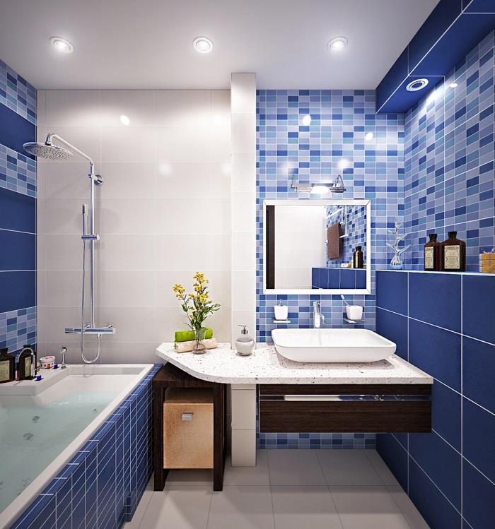 model kopalniških ploščic v temno modri in svetlo modri barvi v kombinaciji s stropom in tlemi iz belih ploščic ter pultom iz belega granita