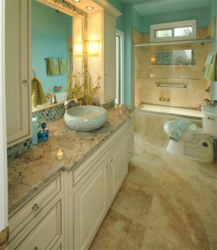 plytelėmis išklotas vonios kambarys-smėlio spalvos grindys-mėlynos sienos-apvali įmontuota kriauklė