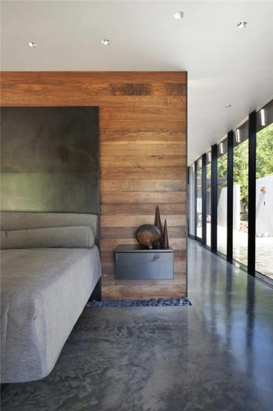 pilkas-betonas-miegamasis-dekoratyvinis-betonas-stalviršis-vaškas-dideli langai