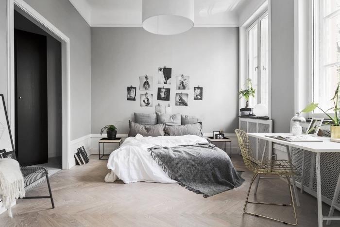 İskandinav yatak odası, hafif parke, gri ve beyaz nevresimler, beyaz masa, metal sandalye, siyah beyaz fotoğraf dekoru, gri duvar nasıl dekore edilir