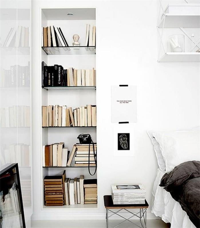Skandinaviškas miegamasis-visa-balta-pilka-lova-užtiesalas-biblioteka, įmontuota sienoje-šviesus ir labai blaivus