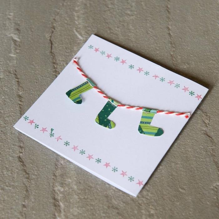 kolay Noel kartı dekorasyonu, sınırda yıldız ve kar tanesi tasarımları ile DIY beyaz kağıt kartı örneği
