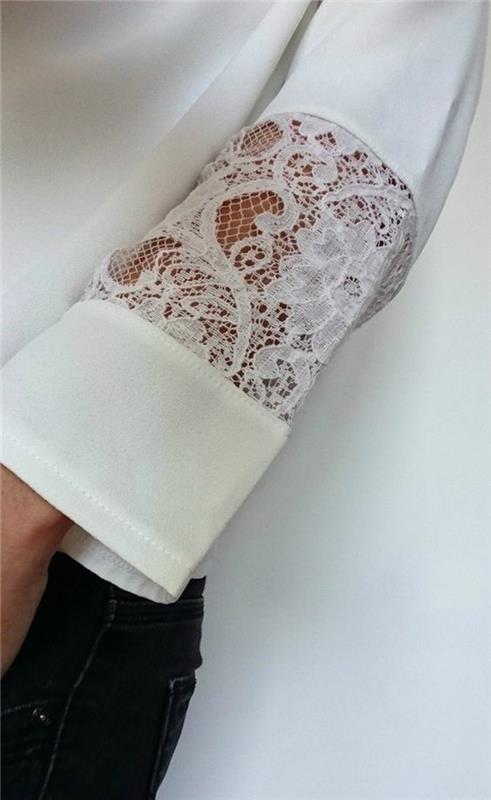 arabesk ve çiçeklerle şeffaf kol üzerinde dantel bluz detayı