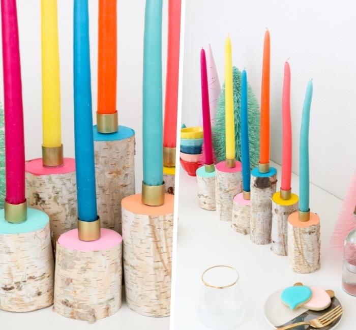 pisane sveče, na vrhu okroglih lesenih blokov, osrednje mize, pobarvane v različnih barvah