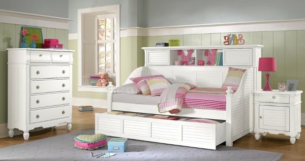 kompaktiškas-vaikų miegamasis-interjero dizainas su kompaktiškomis baltomis lovomis-lovomis, iš kurių matosi neoterinis baltas stalčius