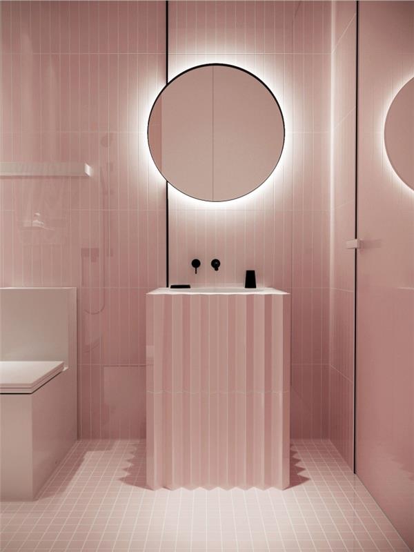 enobarvni videz v pastelno roza barvi v majhni kopalnici s sodobno oblikovanim pohištvom in neonsko razsvetljavo