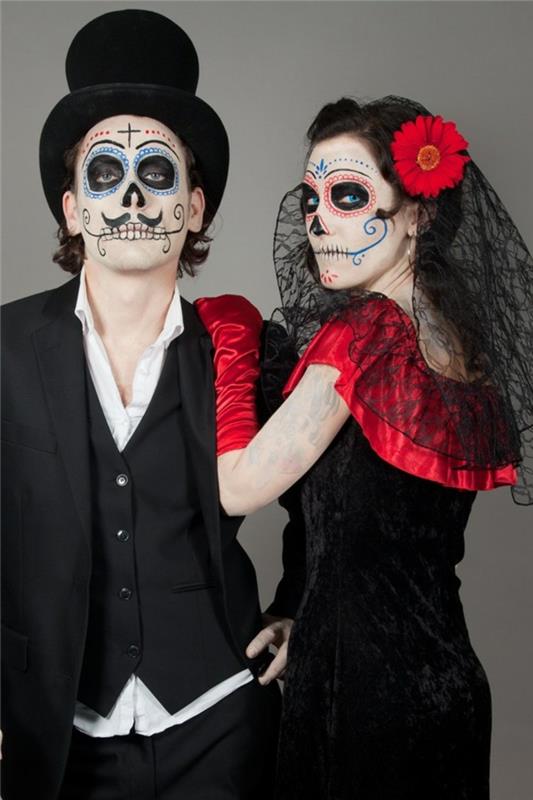 dueto kostiumo idėja, juodi kostiumai, kaukolės makiažas, juodas cilindras, raudona ir juoda suknelė, raudona gėlė