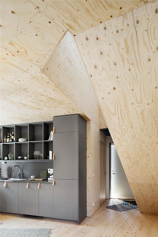futuristinis interjero dizainas šiuolaikiškoje pilkos ir medienos virtuvėje, sienų dangos ir lubų idėja iš šviesios medienos