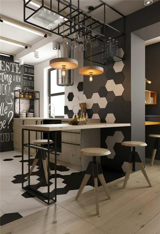 beyaz, siyah ve taupe duvarlardan birinde arı kovanı şeklinde dekoratif paneller ile siyah mutfak