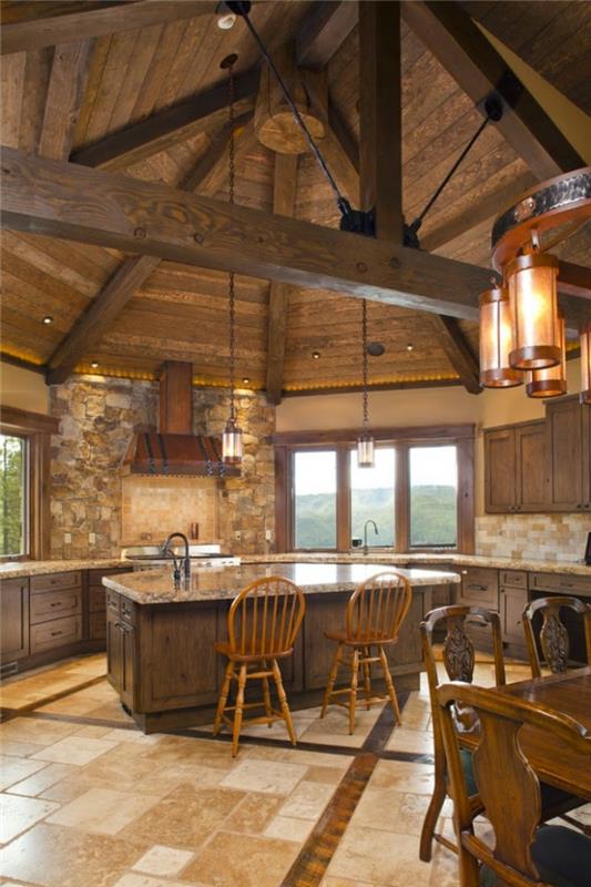 opremljena kuhinja, lesena kuhinja, veliko okno v gore, lesena jedilna miza, bež ploščice