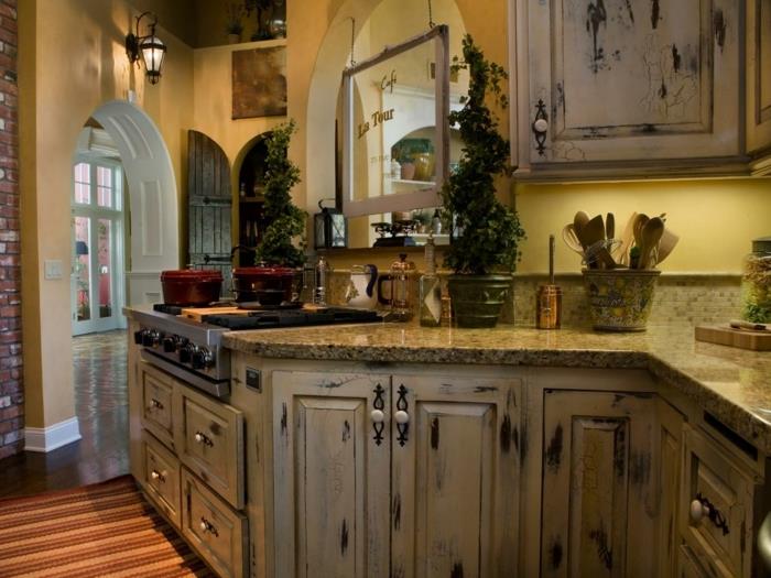 kuhinjski model, trenutna kuhinja, zelene rastline, rumene stene, opečna stena, omamljena elegantna omara, luč