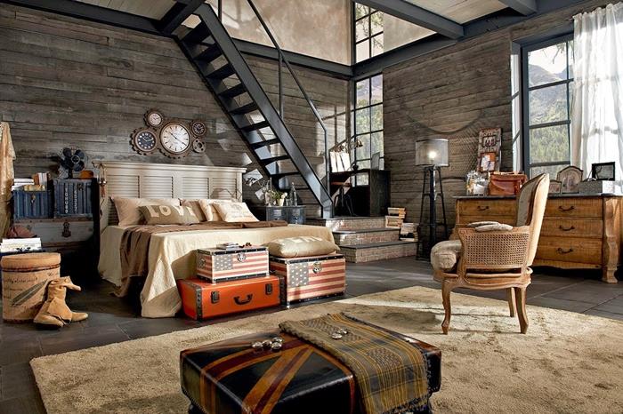 pramoniniai baldai, juodi laiptai, akmeninės sienos, medinė galvūgalis, laikrodis su mechanizmu, minkštas kilimas, pramoninio deko idėja
