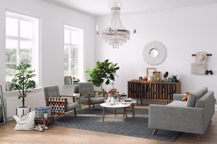 Skandinaviško stiliaus svetainės dekoras baltai pilka švediška sofa