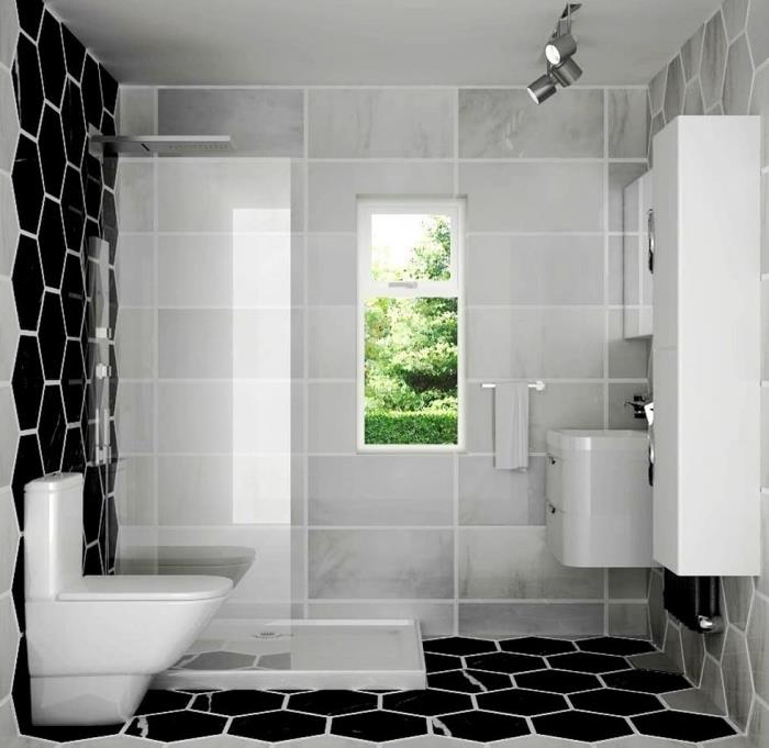sodobno belo-črno notranje oblikovanje v majhni kopalnici s tuš kabino svetlo sive in črne ploščice