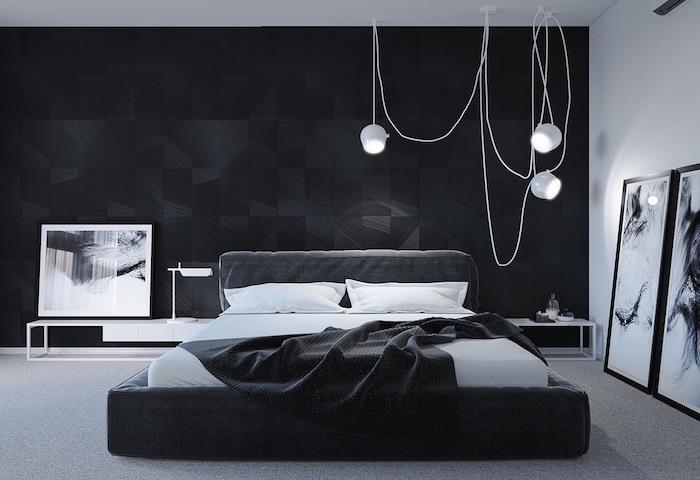 dekor glavne spalnice, siva in črna naglasna stena, siva postelja z belo in sivo posteljnino, grafično oblikovanje