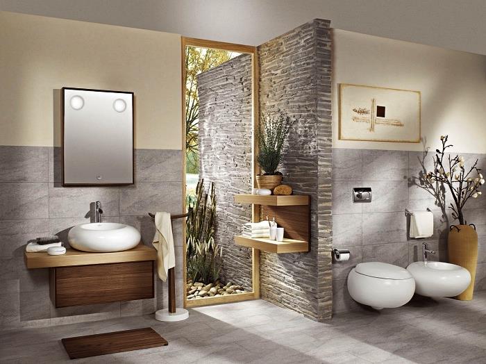 oblikovanje zen in naravne kopalnice v japonskem slogu, svetlo sive ploščice velikega formata, ki pokrivajo tla in del sten