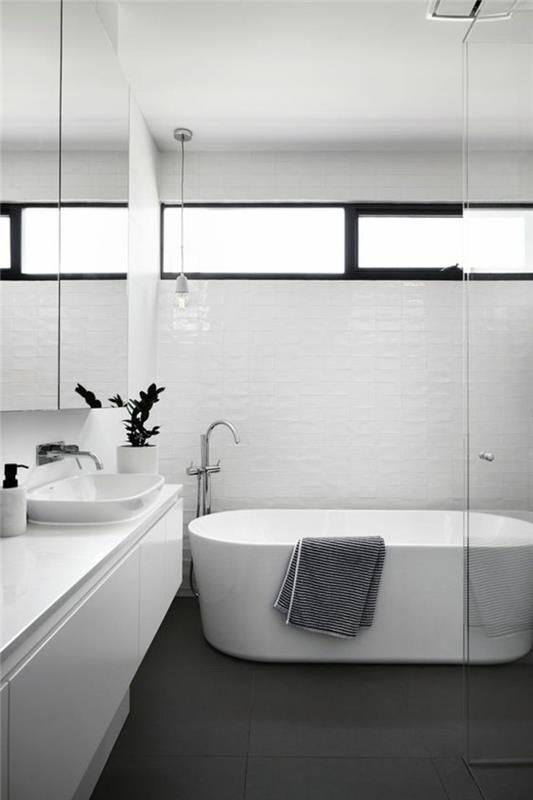 model banyo, oval beyaz küvetli küçük banyo, siyah karo zemin, beyaz duvar ünitesi, beyaz tuğla duvar karoları