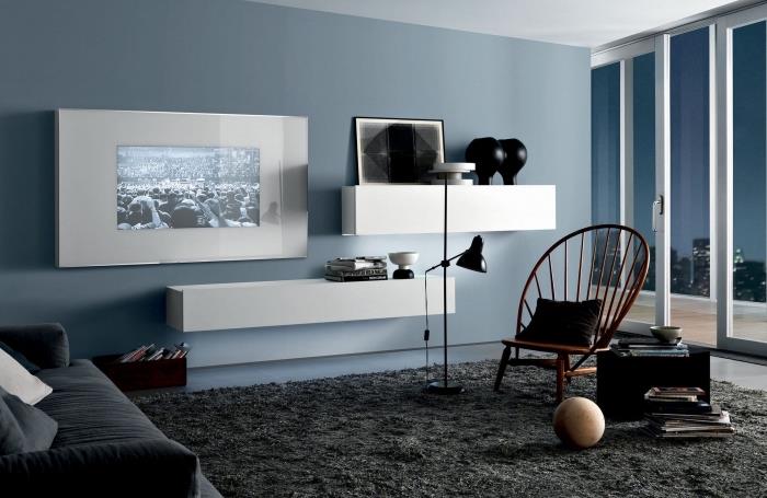 zarif ve sofistike bir minimalist atmosfer için mavi, siyah ve beyaz oturma odası dekoru