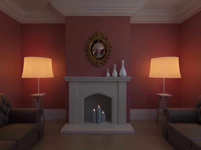 Betoninis pilkas minimalistinis dekoratyvinis dirbtinis židinys su pilkų žvakių trio svetainėje su bordo sienomis ant kilimo ir simetriškų lempų duetu
