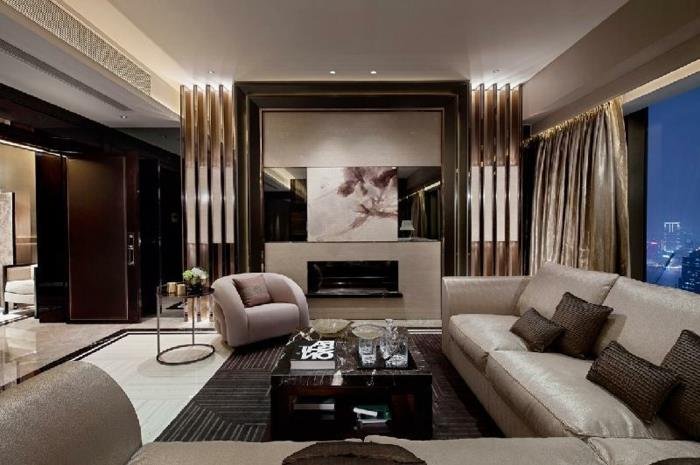 modernus svetainės dekoras, prabangūs apartamentai, dideli patogūs foteliai, atviros erdvės interjeras