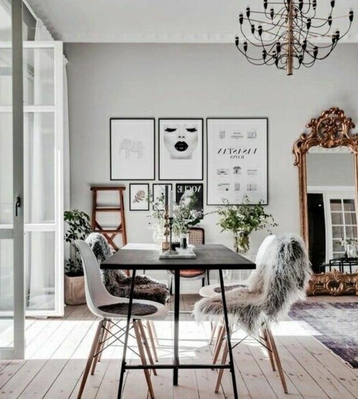 podeželski dekor, kovinska miza, parket iz svetlega lesa, skandinavski stoli, krzno, črno -beli okvir sten, velika vintage ogledala, baročna viseča svetilka