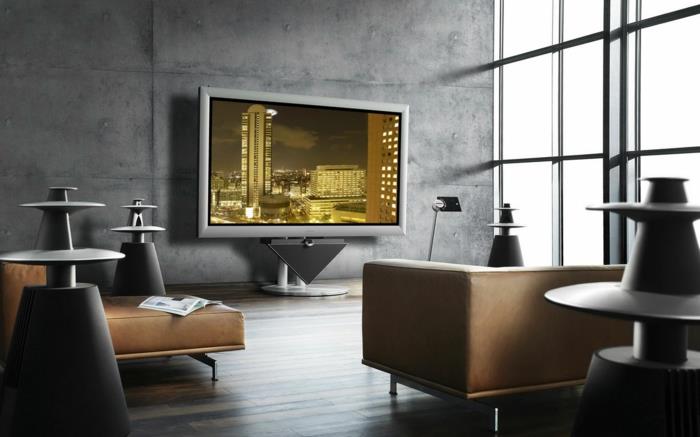 šiuolaikiška apdaila, modernus sieninis televizorius, dailios sofos ir vaškuoto betono danga