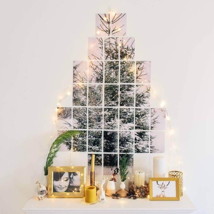Noel ağacı görüntüsü ile orijinal duvar dekorasyonu, geleneksel Noel ağacının yerini alan, ışıltılı bir çelenk ve çok sayıda mumla süslenmiş bir fotoğraf kolajı