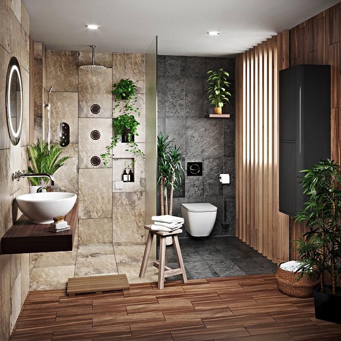razkošna kopalnica iz naravnega kamna z italijansko prho v sivih ploščicah v harmoniji s sproščujočim in zen vzdušjem