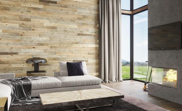modernus interjero dizainas kambaryje su betoniniu židiniu ir skirtingų spalvų medinėmis lentomis dekoruotomis sienomis