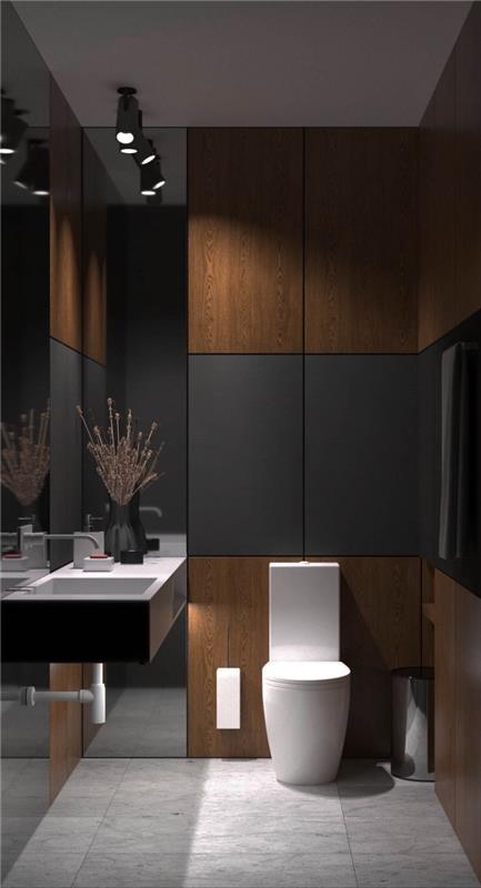 maža šiuolaikiška vonios kambario apdaila su antracito pilkos spalvos plokštėmis, grindų plytelių modelis su marmuro efektu